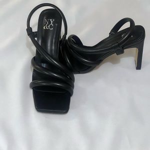 Heeled sandals by New York and Company in black.